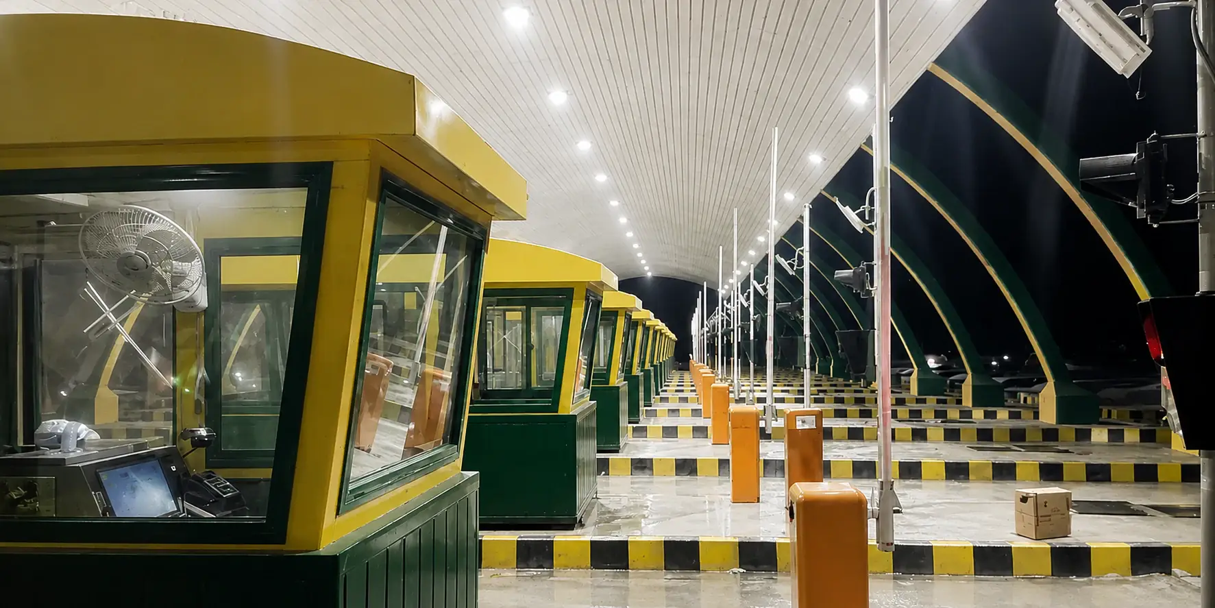 TollX-equipped toll plaza lanes lit up at night